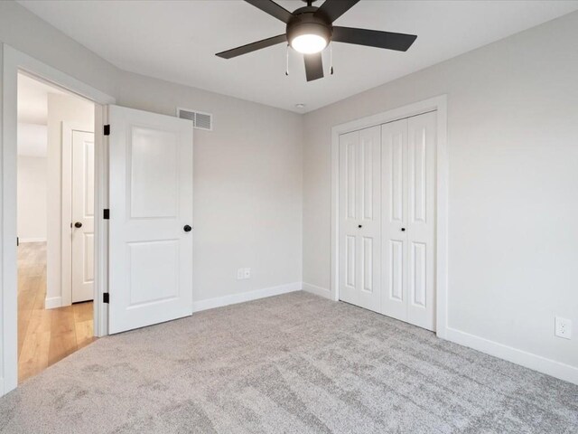 314 Sierra Trce, Coralville, IA 52241 - unfurnished bedroom with carpet, a closet, and a ceiling fan