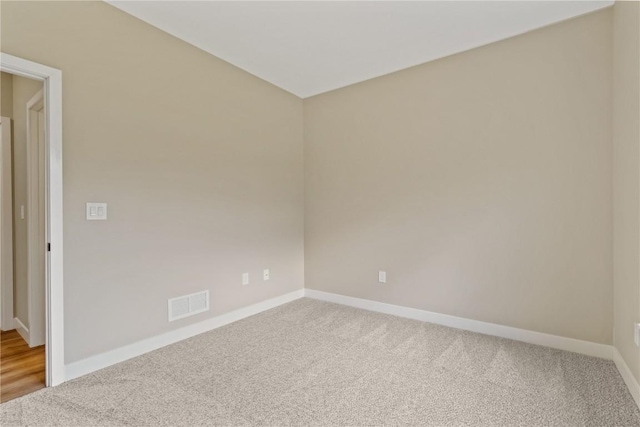 unfurnished room with carpet flooring