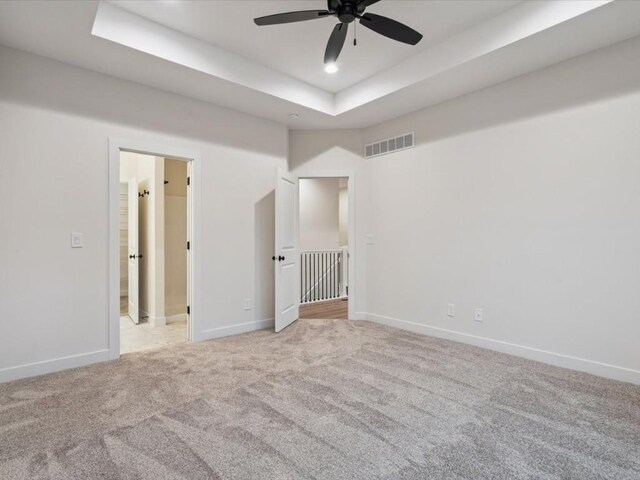 318 Sierra Trce, Coralville, IA 52241 - empty room featuring a raised ceiling, a ceiling fan, light carpet, and recessed lighting