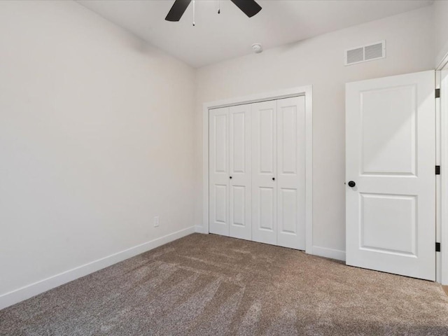 318 Sierra Trce, Coralville, IA 52241 - unfurnished bedroom featuring carpet, a closet, and ceiling fan