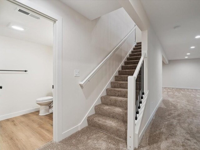 318 Sierra Trce, Coralville, IA 52241 - stairway with recessed lighting and carpet flooring