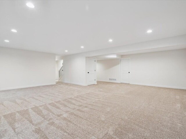 318 Sierra Trce, Coralville, IA 52241 - finished basement featuring recessed lighting, light carpet, and stairs