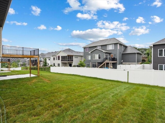 318 Sierra Trce, Coralville, IA 52241 - view of yard with a residential view and a wooden deck