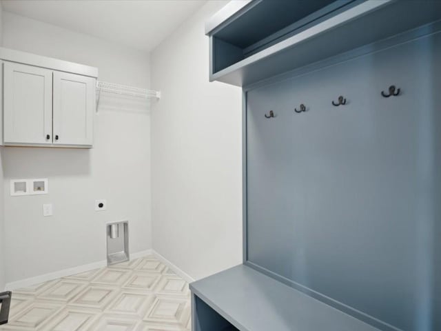 washroom featuring cabinets, washer hookup, and electric dryer hookup