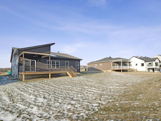 rear view of house featuring a deck