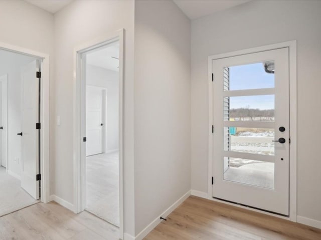 doorway to outside featuring light wood-type flooring