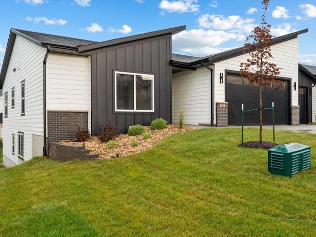 322 Sierra Trce, Coralville, IA 52241 - view of front of property with board and batten siding, brick siding, a garage, and concrete driveway