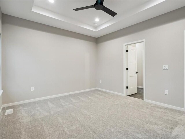 322 Sierra Trce, Coralville, IA 52241 - unfurnished room featuring a tray ceiling, carpet floors, a ceiling fan, and recessed lighting