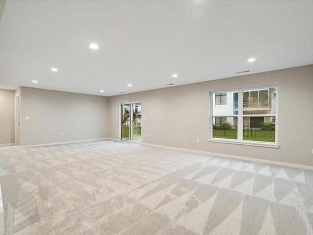 322 Sierra Trce, Coralville, IA 52241 - unfurnished room with light carpet and recessed lighting