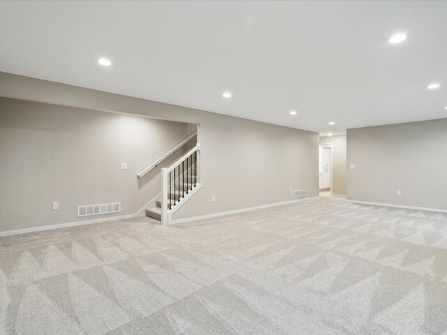 322 Sierra Trce, Coralville, IA 52241 - finished basement with recessed lighting, stairway, and light carpet