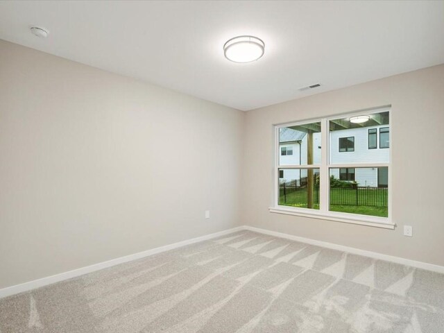 322 Sierra Trce, Coralville, IA 52241 - spare room featuring carpet and a smoke detector