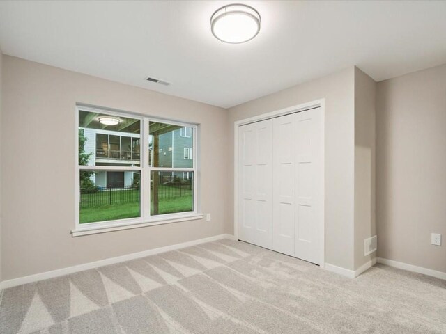 322 Sierra Trce, Coralville, IA 52241 - unfurnished bedroom with carpet flooring and a closet