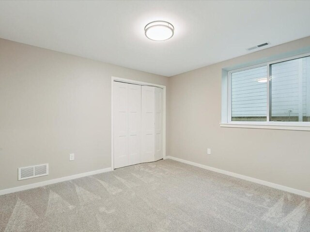322 Sierra Trce, Coralville, IA 52241 - unfurnished bedroom with carpet flooring and a closet