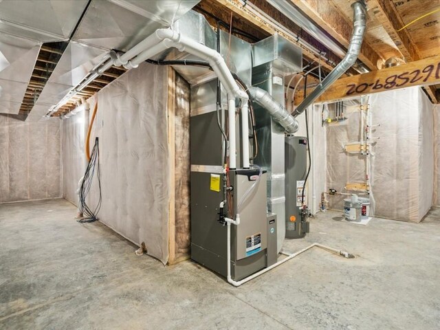 322 Sierra Trce, Coralville, IA 52241 - unfinished basement featuring gas water heater
