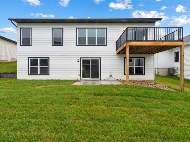 322 Sierra Trce, Coralville, IA 52241 - rear view of house with a lawn and a deck