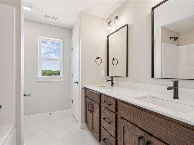 4648 Preston Ln, Iowa City, IA 52246 - bathroom featuring marble look tile flooring and double vanity