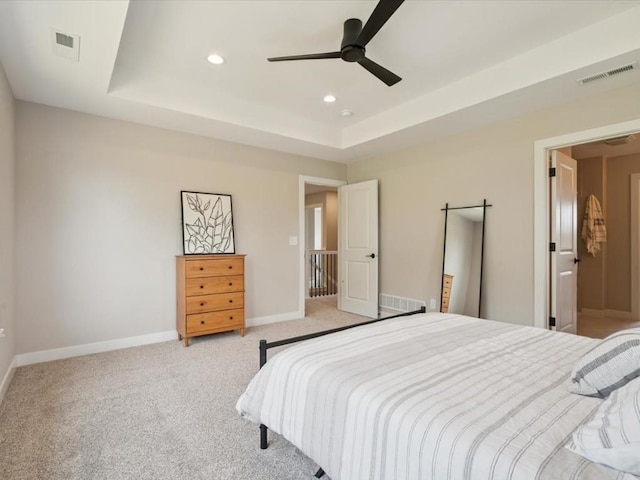 4648 Preston Ln, Iowa City, IA 52246 - bedroom with recessed lighting, light carpet, a tray ceiling, and a ceiling fan