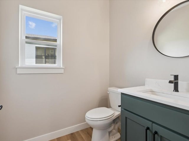 4648 Preston Ln, Iowa City, IA 52246 - bathroom featuring wood finished floors and vanity