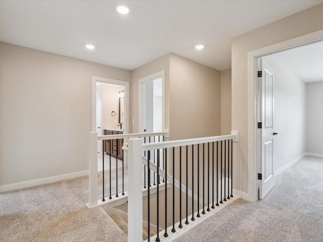 4648 Preston Ln, Iowa City, IA 52246 - corridor with an upstairs landing, carpet floors, and recessed lighting