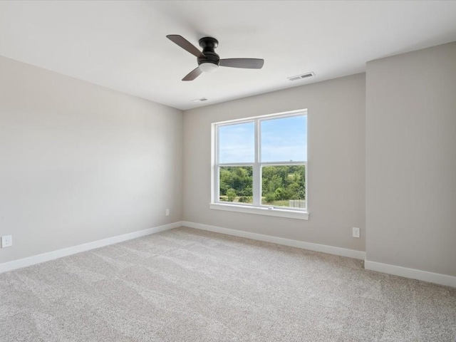 4648 Preston Ln, Iowa City, IA 52246 - empty room with light carpet and a ceiling fan