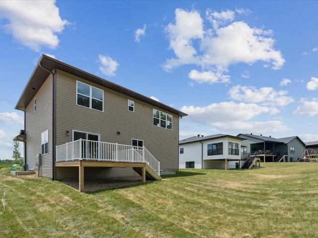 4648 Preston Ln, Iowa City, IA 52246 - rear view of property with a deck, a yard, and stairway