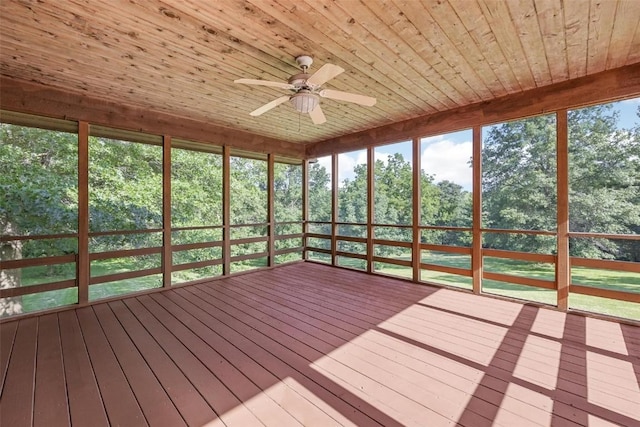 unfurnished sunroom with ceiling fan and wooden ceiling