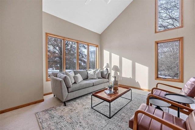 living room featuring carpet floors and high vaulted ceiling