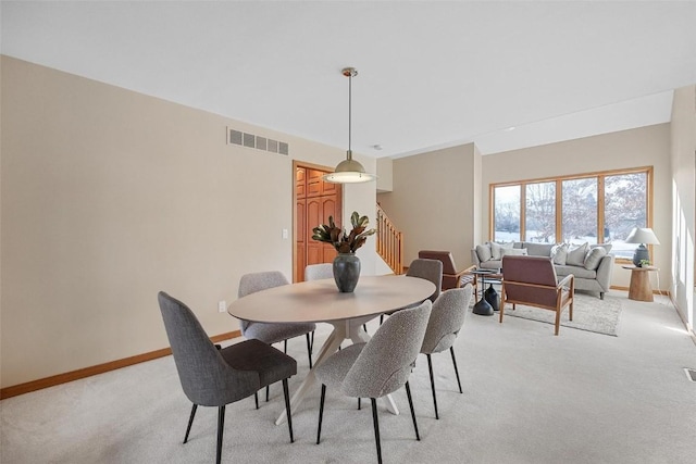 view of carpeted dining space