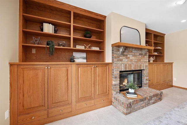 carpeted living room featuring a brick fireplace