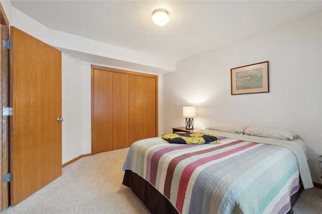 carpeted bedroom featuring a closet