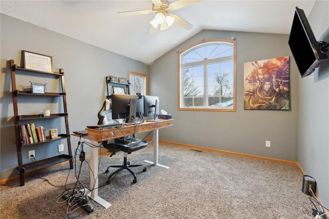 carpeted home office featuring vaulted ceiling and ceiling fan