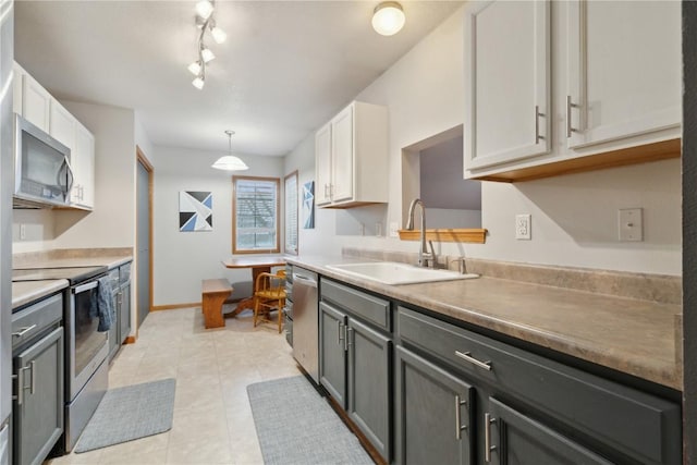 kitchen featuring white cabinetry, sink, stainless steel appliances, pendant lighting, and gray cabinets