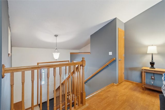 staircase featuring wood-type flooring