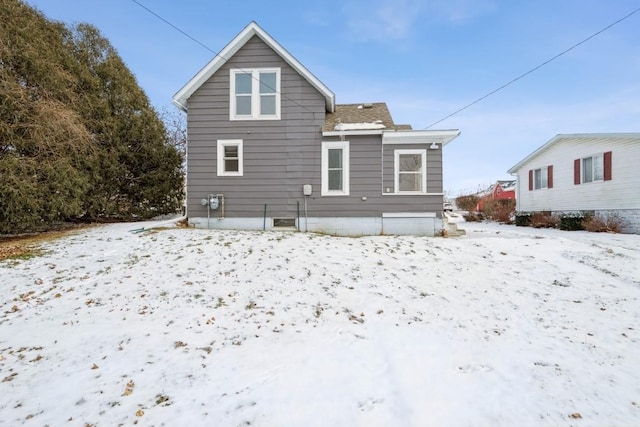 view of snow covered house