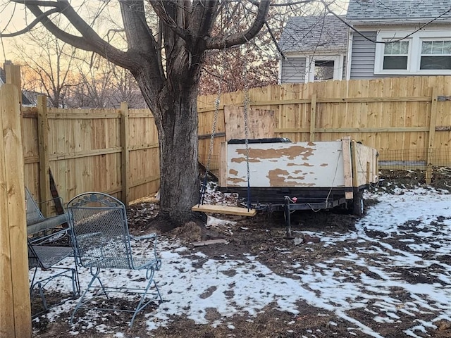 view of yard layered in snow