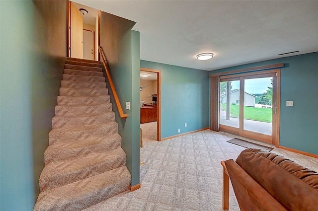 interior space featuring light colored carpet