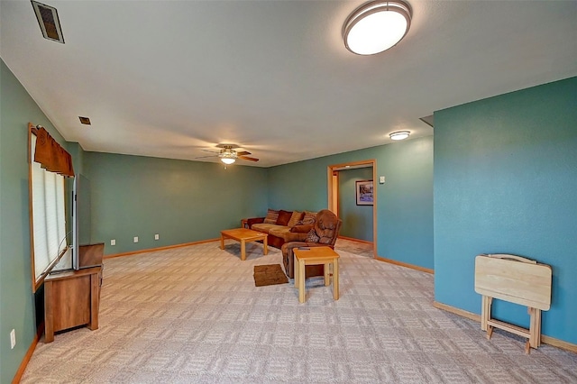 living room with light carpet and ceiling fan