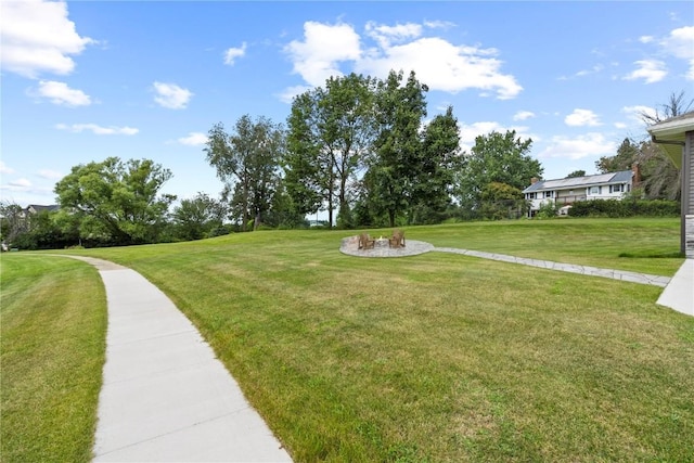 view of property's community with a lawn