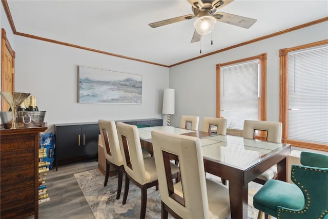 dining room featuring hardwood / wood-style flooring, ceiling fan, and ornamental molding