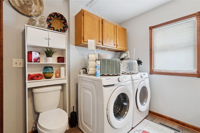 laundry area with washing machine and dryer