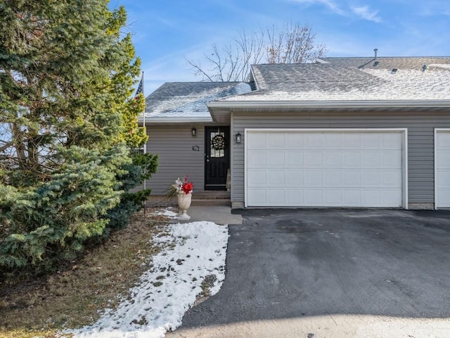 single story home featuring a garage