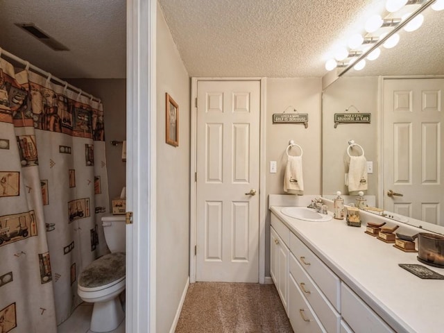 full bath featuring visible vents, toilet, a textured ceiling, vanity, and water heater