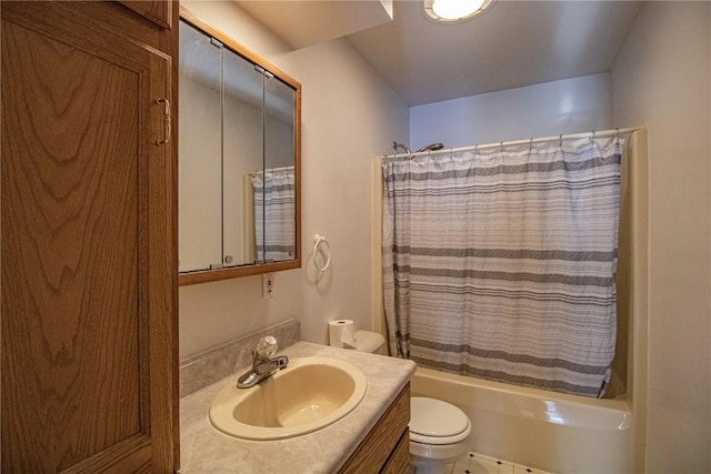 full bathroom featuring shower / bath combo, toilet, and vanity