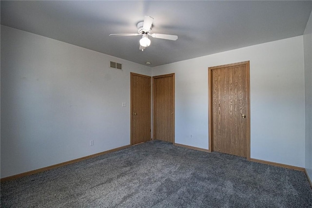 empty room featuring carpet and ceiling fan