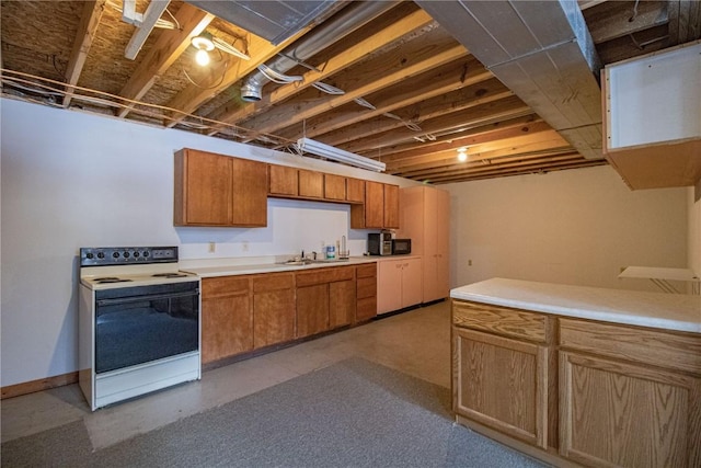 kitchen featuring electric range and sink