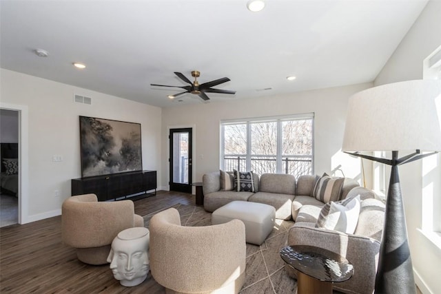 living area featuring dark wood-style floors, baseboards, visible vents, and recessed lighting