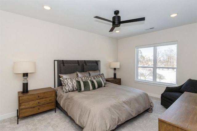 bedroom with recessed lighting, light colored carpet, visible vents, and baseboards