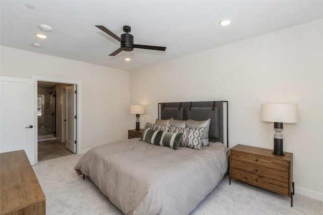 bedroom with recessed lighting, ensuite bath, a ceiling fan, and light colored carpet