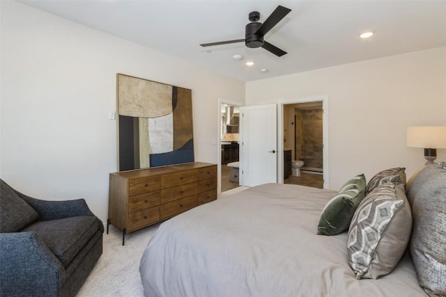 bedroom featuring ceiling fan, recessed lighting, light colored carpet, and ensuite bathroom