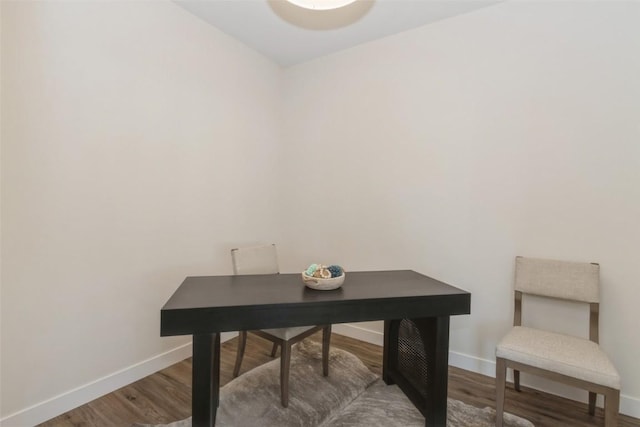 office area featuring baseboards and wood finished floors